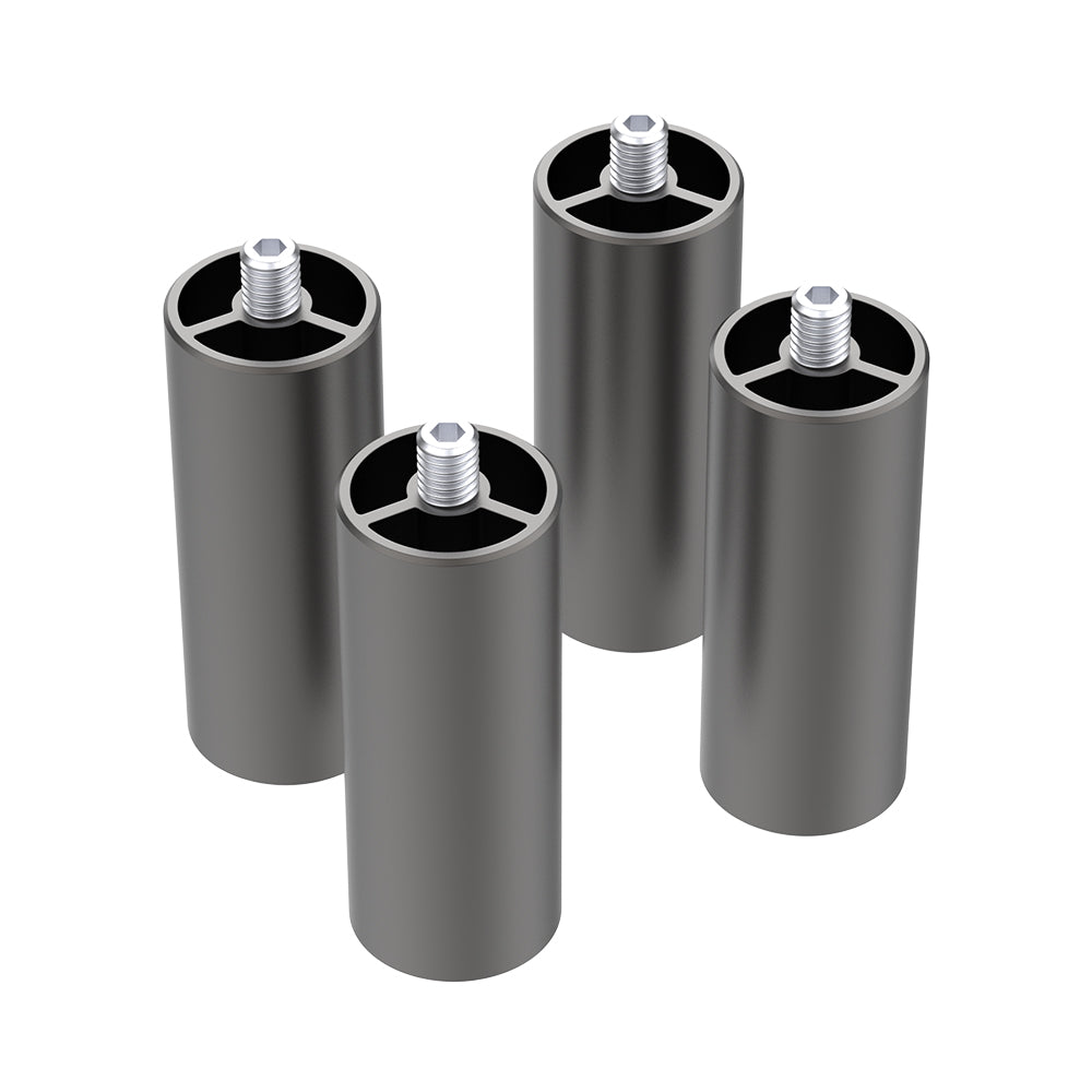 Four cylindrical metal spacers with threaded posts are standing upright. They have a dark grey finish and feature internal cross-shaped structures at the top. Each spacer appears hollow, with the internal structure visible from above. Ideal for use with 22W machines and Crealityfalcon2 setups, these are the Creality Falcon2 Extra Risers (4 Packs) from CrealityFalcon.