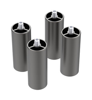 Four cylindrical metal spacers with threaded posts are standing upright. They have a dark grey finish and feature internal cross-shaped structures at the top. Each spacer appears hollow, with the internal structure visible from above. Ideal for use with 22W machines and Crealityfalcon2 setups, these are the Creality Falcon2 Extra Risers (4 Packs) from CrealityFalcon.