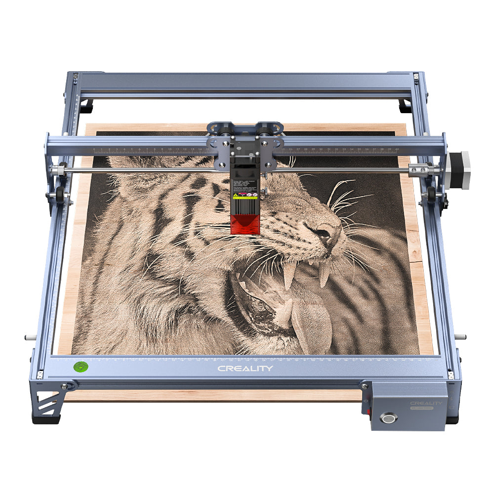 A CrealityFalcon Falcon 7.5W Laser Engraver with a large workspace is shown engraving a detailed image of a tiger's face onto a wooden surface. The metallic frame supports the machine as it uses a compressed spot to reveal intricate details of the tiger's fur and facial features.
