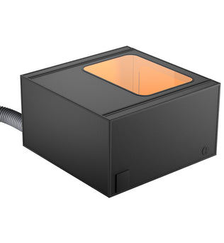 Introducing the Protection Enclosure Pro for Falcon Laser Engravers by CrealityFalcon: a sleek, black, rectangular electronic device featuring a transparent top window that reveals an orange interior. A coiled cable extends from the left side, indicating connectivity or power supply to another device. Boasting a minimalistic and modern design, this enclosure is both dustproof and waterproof for enhanced durability.