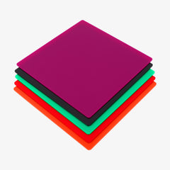 A stack of four square sheets from the Basswood and Colorful Acrylic Sheets 12x12'' for Laser Engraving and Cutting Mega Pack by CrealityFalcon is displayed in vibrant colors. From top to bottom, they feature magenta, green, black, and orange. These sheets resemble opaque glossy colorful acrylic boards and are neatly aligned in an even stack on a white background.