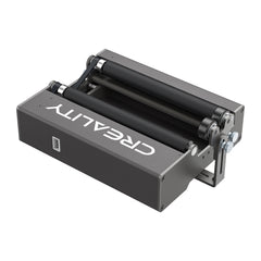 A metallic device called the "Creality Falcon" Rotary Roller for Laser Engraving Machine features adjustable width and multiple rollers. This box-shaped tool is perfect for 3D printing processes, helping to refine printed surfaces and accommodating various diameter ranges for versatile application.