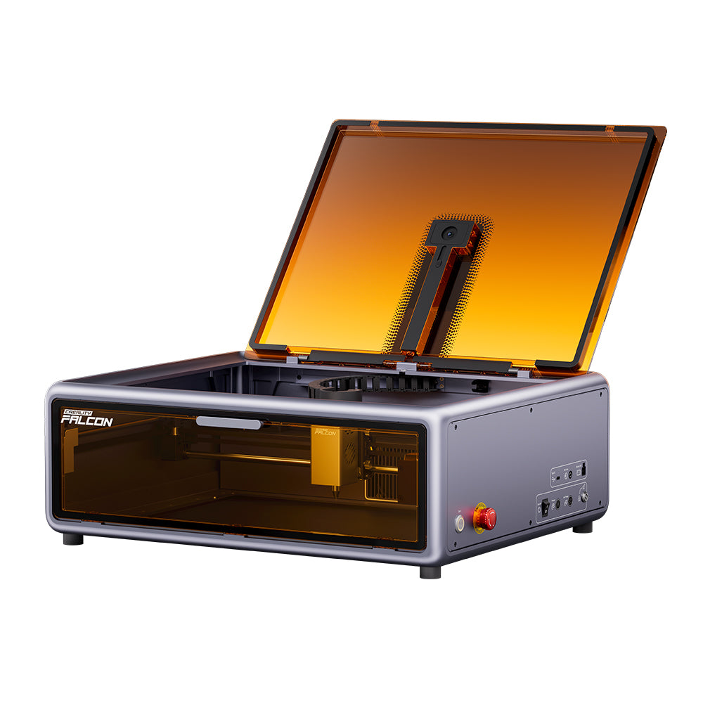 The Falcon A1 10W Enclosed Laser Engraver and Cutter by Creality Falcon features a CoreXY interior, sleek design, transparent amber cover, and side control panel with buttons and ports. It includes Auto Materials Recognition for optimal performance.