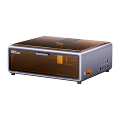 The Creality Falcon A1 10W Engraver and Cutter has a sleek rectangular design with a transparent orange cover. It features Auto Materials Recognition, control buttons on the right side, and visible internal mechanisms, offering a compact form that fits seamlessly into any space.