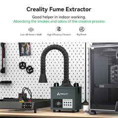 The Creality Falcon Air Purifier for 10W Engraving Machines sits on a workspace with a pegboard backdrop, featuring an adjustable hose and control panel to absorb smoke and odors. Nearby are tools and 3D printer accessories. It boasts low noise operation, HEPA filters for high filtration, and robust power.