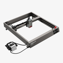 A CrealityFalcon branded laser engraving machine model Falcon2 22W Laser Engraver and Cutter is shown. It features a sturdy metal framework, an engraving head mounted on a rail system, and a control panel on the front right. With its extensive compatibility, the 22W cutting power makes it versatile for various materials.