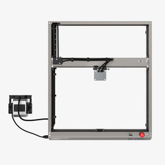 The CrealityFalcon Falcon2 22W Laser Engraver and Cutter features a square-shaped metal frame with an open structure, visible cables, and a control box mounted on the left side. A red power button is located in the bottom right corner of the frame. Designed for extensive compatibility, it includes multiple mounting points and various mechanical components are noticeably visible.