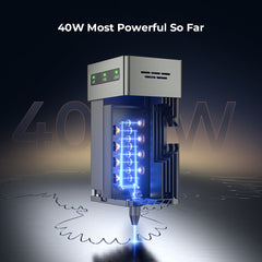 A high-tech CrealityFalcon Falcon2 40W Laser Engraver and Cutter is shown, emitting a blue laser beam with a cutting speed of 25000mm/min. The text "40W Most Powerful So Far" is displayed at the top. The device features a sleek metallic finish and several illuminated components, ensuring advanced safety measures. The background is dark with a metallic surface.